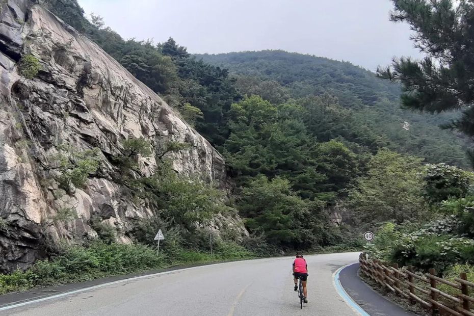 Man cycling along a bike path in Korea