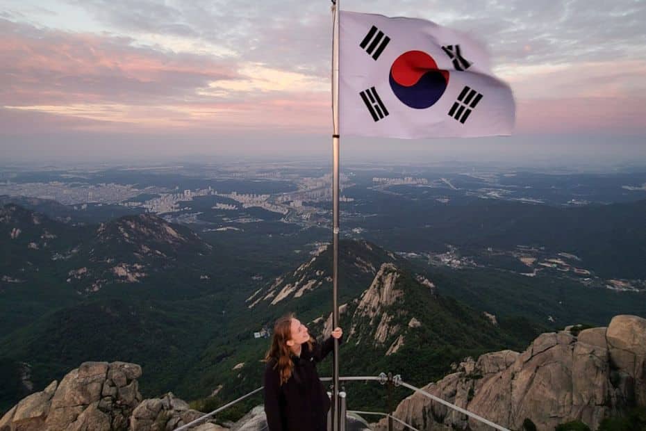 Person holding Korean flag on Baegundae Peak